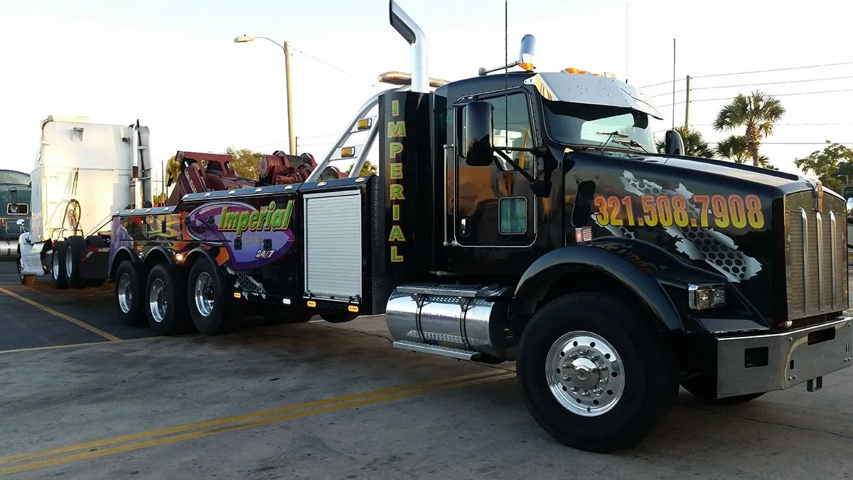 Imperial Towing heavy wrecker towing a semi truck